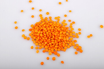 Red lentil isolated on white background.