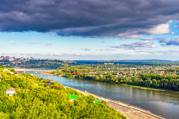 View from observation deck to residential districts of Ufa and Belaya river in summer evening at sunset. Beautiful cityscape, popular view of Ufa city, capital of Bashkiria