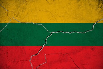 An image of the Lithuania flag on a wall with a crack.