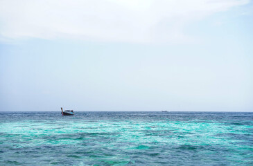 seascape scenery,blue sea water, local fishing boat