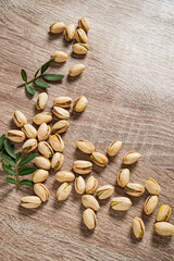 Pistachios on the wooden background