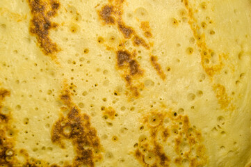 Fresh homemade pancakes on a plate close-up. Shrovetide. Pancake day. Maslenitsa. Cooked food for the holiday. Soft focus