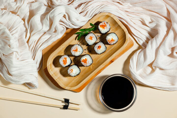 Fish food - sushi, on a bright colored background.