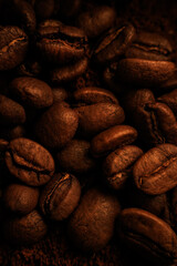 Macrophotography of coffee beans. Coffee close-up. Advertising backdrop for coffee shop or restaurant. Aromatic roasted coffee of fresh harvest.