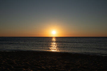 Naklejka premium epic sunset by the beach on the island of crete
