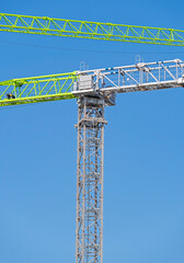 Fototapeta na wymiar construction crane at sky as background