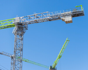 Naklejka premium construction crane at blue sky background