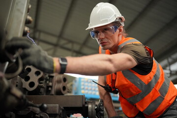 Industrial Engineers in Hard Hats.Work at the Heavy Industry Manufacturing Factory.industrial worker indoors in factory. man working in an industrial factory.