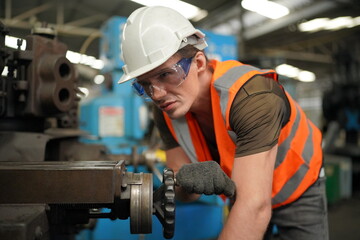 Industrial Engineers in Hard Hats.Work at the Heavy Industry Manufacturing Factory.industrial worker indoors in factory. man working in an industrial factory.