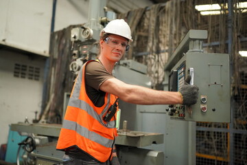 Industrial Engineers in Hard Hats.Work at the Heavy Industry Manufacturing Factory.industrial worker indoors in factory. man working in an industrial factory.