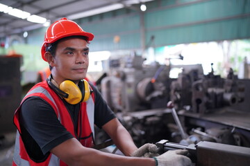 Industrial Engineers in Hard Hats.Work at the Heavy Industry Manufacturing Factory.industrial worker indoors in factory. man working in an industrial factory.