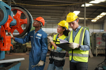 Industrial Engineers in Hard Hats.Work at the Heavy Industry Manufacturing Factory.industrial worker indoors in factory. man working in an industrial factory.