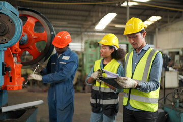 Industrial Engineers in Hard Hats.Work at the Heavy Industry Manufacturing Factory.industrial worker indoors in factory. man working in an industrial factory.