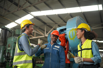 Industrial Engineers in Hard Hats.Work at the Heavy Industry Manufacturing Factory.industrial worker indoors in factory. man working in an industrial factory.