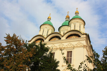 Fototapeta na wymiar Orthodox church with green domes