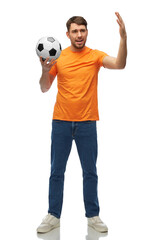 sport, leisure games and people concept - happy smiling man or football fan with soccer ball over...