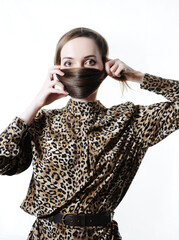 Long hair wrapped around the face like a mask. Fashion hairstyle concept. Studio photo on white