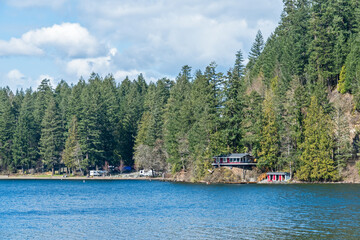 Fototapeta na wymiar Lake overview with camp ground and water front residential house