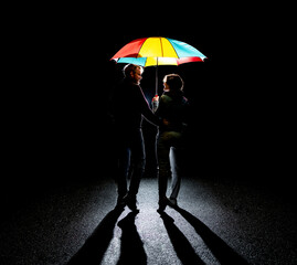 Pair under shining umbrella