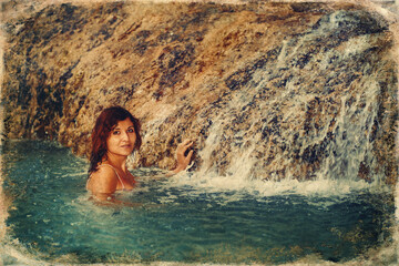 beautiful woman near the waterfall.