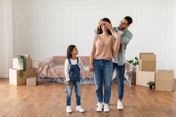 Happy loving young family celebrating relocation together
