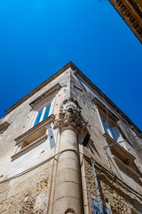 Angle column. Empty street low-angle architectural view, Lecce, Brindisi, Italy