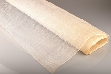 Sinamay fabric is a versatile basic fabric used in hat making. It is woven from the fibers of the Abaca tree found in the Philippines.