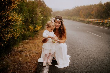 mother and daughter in wedding dress in the mountains of madeira portugal
