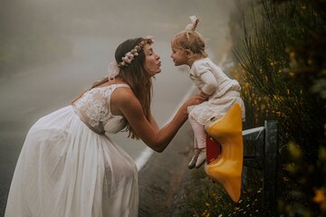 mother and daughter in wedding dress in the mountains of madeira portugal