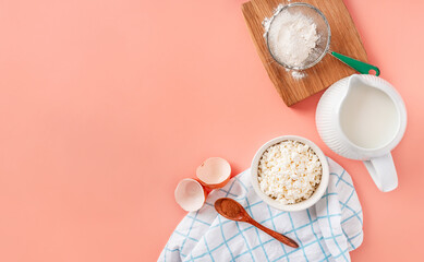 Beautiful baking background. Ingredients for baking: eggs, flour, sugar, butter on a pink background. Space for copying. Banner