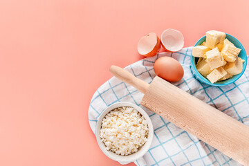 Beautiful baking background. Ingredients for baking: eggs, flour, sugar, butter on a pink background. Space for copying. Banner