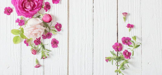 pink and red roses on white wooden background