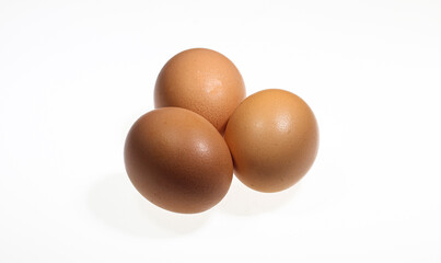 Raw chicken brown eggs isolated on a white background with clipping path.