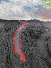Volcanic river flowing between the solidified lava in Pacaya volcano of Guatemala