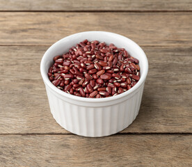 Azuki beans in a bowl over wooden table