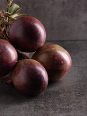 Caimito a bunch of ripe caimito, STAR APPLE, vertical view, high sharpness