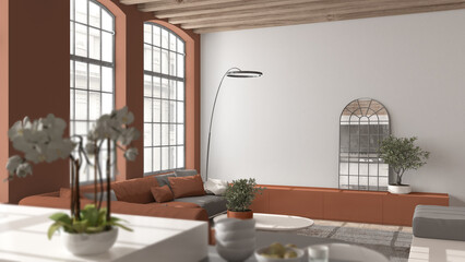 Modern kitchen and living room in vintage apartment in beige and orange tones, windows, flowers close up, depth of fields, sofa. Classic parquet, wooden roof beams, interior design