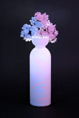 Vase with flowers, play of shadows and colors, roses in a vase blue and pink, roses in two colors with a vase
