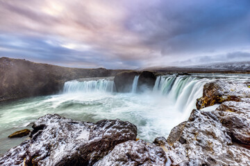 Early morning light at the majestic Godafoss waterfall, in northern Iceland. This horseshoe shaped fall is 30 metres wide