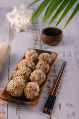 The photo shows the Japanese dessert Mochi. Round shaped sweets