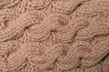 Knitted woolen sweater as background, closeup