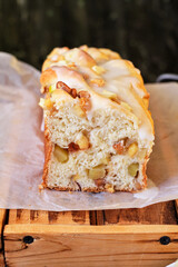 Babka with apple and almonds. Side view.