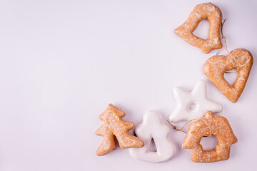 white and brown gingerbread on white background copy space