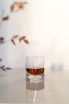 Glass of cognac on a marble table