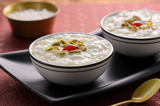 Sabudana Kheer thick pudding with tapioca pearls sago dessert from cassava root Indian sweet mithai  chowari payasam for Mahashivratri Ram Navami Diwali festival.