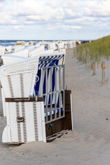 A beach chair next to a dune