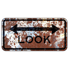Old rusty American road sign - Look both ways at track