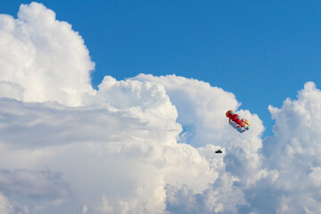 beautiful paraglider sailing among the clouds