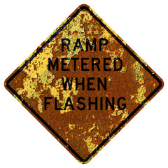Old rusty American road sign - Ramp metered when flashing