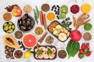 Healthy food collection for immune system boost with seafood, vegetables, fruit, herbs and spice. Foods and herbal medicine high in antioxidants, anthocyanins, protein, fibre, vitamins and omega 3. 

